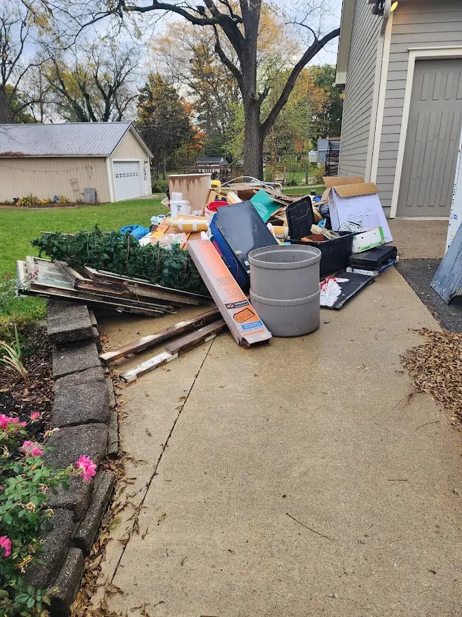Dumpster being loaded with debris for Commercial Dumpster Rental in Sartell